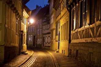 Half-timbered houses in a narrow street with cobblestones, Old Town in the evening, World Heritage