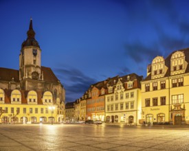 The market square with the Wenceslas Church and town houses with Renaissance gables at dusk,