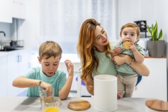Schoolboy enjoying breakfast with his family at home dipping the cookies in the milk