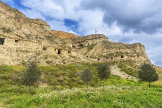 Scenic view of cuevas de arguedas, ancient cave dwellings carved into sandstone cliffs,