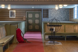 Pilgrim's rucksack in a wooden church, Kvam, Upper Gudbrandsdalen, Norway, Europe