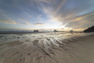 Structures in the sand, sunrise at low tide on the beach of Koh Ngai Island, Andaman Sea, Satun