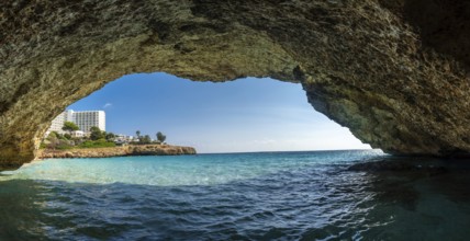 Capturing a breathtaking view of turquoise waters and a resort in cala domingos, mallorca, from