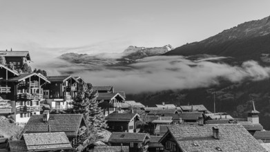 Roofs covered with hoarfrost, fog rising, black and white photo, Grimentz, Val d'Anniviers, Valais