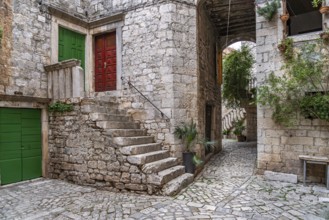 Narrow alley in the old town centre of Trogir, Croatia, Europe