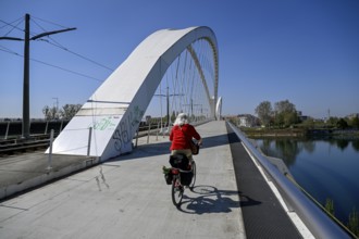 Cyclist on the Beatus-Rhenanus-Bridge, tram bridge over the Rhine, Kehl, Ortenaukreis,