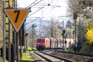 Goods train with a Deutsche Bahn AG locomotive travelling on the open track. Stuttgart,
