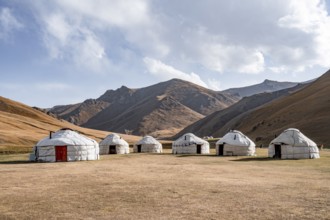 Yurts with yellow hills, Atbashy district in the Naryn region, Kyrgyzstan, Asia