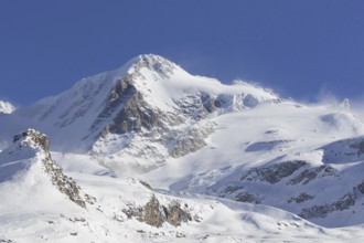 Snow covered mountaintop, pinnacle of the Gran Paradiso mountain in winter in the Gran Paradiso