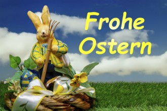 Easter greetings: Easter bunny with colourful Easter eggs with text FROHE OSTERN (Composing)