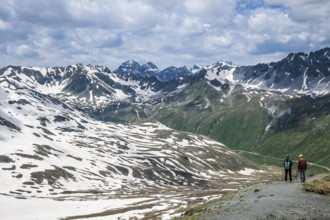 Stilfserjoch, Vinchgau, South Tyrol, Italy -Hiker on a hiking trail above the Stilfser Joch pass