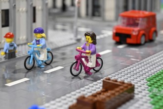 Lego figure with bicycle