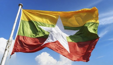 Flags, the national flag of Myanmar flutters in the wind