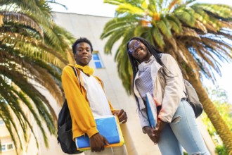 African american university students standing proud smiling at camera in the campus