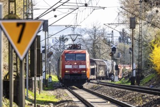 Goods train with a Deutsche Bahn AG locomotive travelling on the open track. Stuttgart,