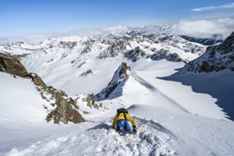 Mountaineer with ice axe and crampons, ascent through steep snowfield to Piz Kesch or Piz d'Es-cha