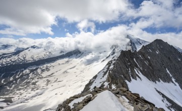 View of snow-covered mountain landscape with glaciated summit Großer Möseler and glacier