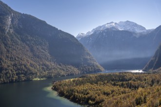 View of the Königssee, from the Rinnkendlsteig, autumnal forest and snow-covered mountains,