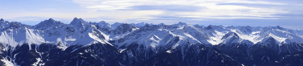 Alpine panorama with snow-covered mountain peaks in winter. Taken in the ski resort of Serfaus Fiss