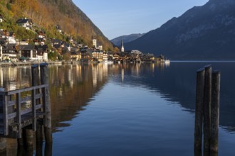 View of Hallstatt and Lake Hallstatt. In the morning in autumn. Good weather, blue sky. Reflection.