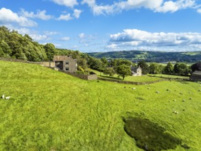Farms and Fields over Cononley and River Aire from a drone, Keighley, North Yorkshire, England,