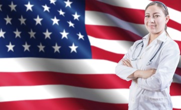 Portrait of female doctor with crossed arms with USA flag in the background. Health and care with