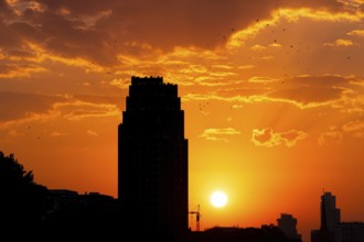 The sun sets behind the Mainplaza Hotel in Frankfurt am Main, Frankfurt am Main, Hesse, Germany,