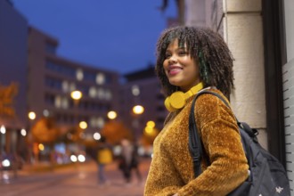 Portrait of black ethnic girl in the early morning going to the university on the way back to