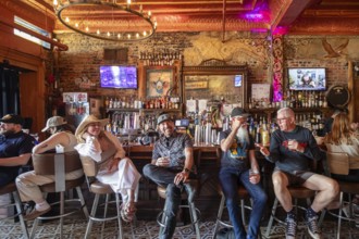 New Orleans, Louisiana - People at the bar drink and listen to music at Bamboula's music club on