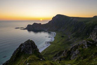 View of coastal landscape at sunset, cliffs and summit of Måtind or Måtinden, Høyvika beach and