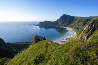 View of coastal landscape, cliffs with peak Måtind or Måtinden, Høyvika beach and sea, hike to the