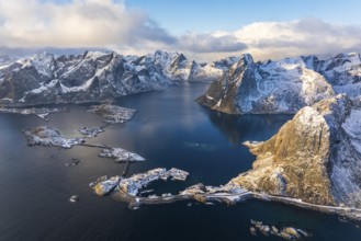 View of islands, fjord and mountains, snow-covered landscapeFishing villages Hamnøy, Sakrisøy and