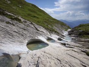 Glacier mill with glacier pots on the Trinser Alp Mora, Trin, Canton Graubünden, Switzerland,