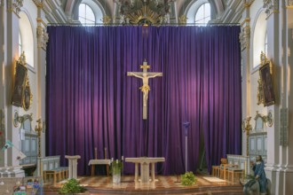 Large purple Lenten cloth in front of the high altar in the baroque parish church of St Nicholas,