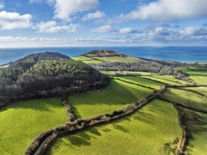 Farms over Morcombelake Village from a drone, Bridport, Dorset, England, United Kingdom, Europe