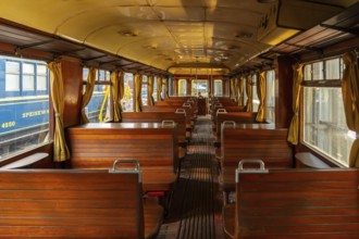Passenger carriage with wooden benches at Stoomtrein Maldegem-Eeklo, heritage railway association