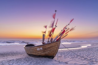 Traditional wooden fishing boat on the beach along the Baltic Sea at Stubbenfelde, Loddin on the