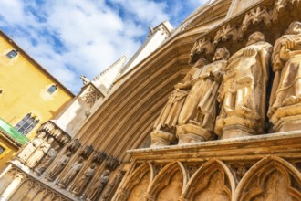 Ancient statues decorating the entrance of tarragona cathedral in spain, showcasing architectural
