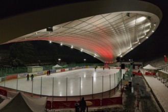 Tourists on ice rink, ice sports stadium, ice skating in the evening, Schierker Feuerstein Arena,