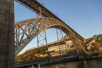 Golden hour at Dom Luis I Bridge crossing River Douro to Vila Nova de Gaia, Porto, Portugal, Europe