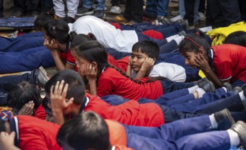 Students take part in a drill as part of a civil defence drill on May 10, 2025 in Guwahati, India,