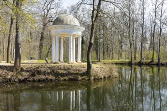 Diana Temple in Lützschena Castle Park with reflection in the water, Leipzig, Saxony, Germany,