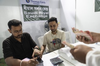 Hajj pilgrims cxchange money at Hajj Musafir Khana to before leaving to the airport, in Guwahati,