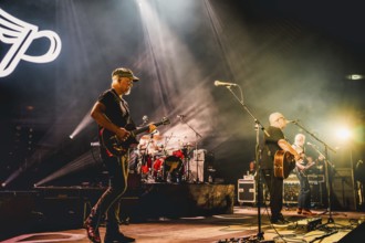 Joey Santiago (guitarist), Black Francis (singer and guitarist) and Emma Richardson (bassist) of