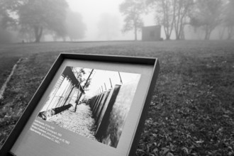 Historical photo at the site of the isolation barracks in beech forest concentration camp, today a