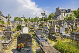 Tombstones in an old cemetery in a French old village, Locronan, Bretagne, France, Europe