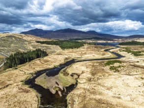 Mountains and Moors over Loch Tulla and River Orchy from a drone, Highlands, Scotland, UK