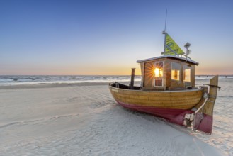 Traditional wooden fishing boat on the beach along the Baltic Sea at Ahlbeck, Heringsdorf on the