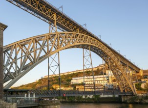 Golden hour at Dom Luis I Bridge crossing River Douro to Vila Nova de Gaia, Porto, Portugal, Europe