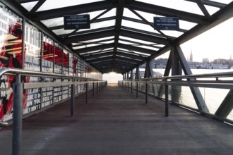 Glass-roofed bridge with a view of the city in the background, The Lion King, Hamburg, Germany,